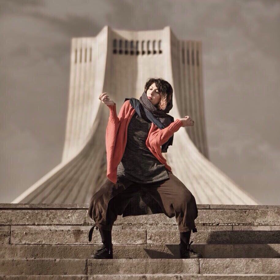 Armineh Turgeon dancing on the steps before the Freedom Tower in Tehran
